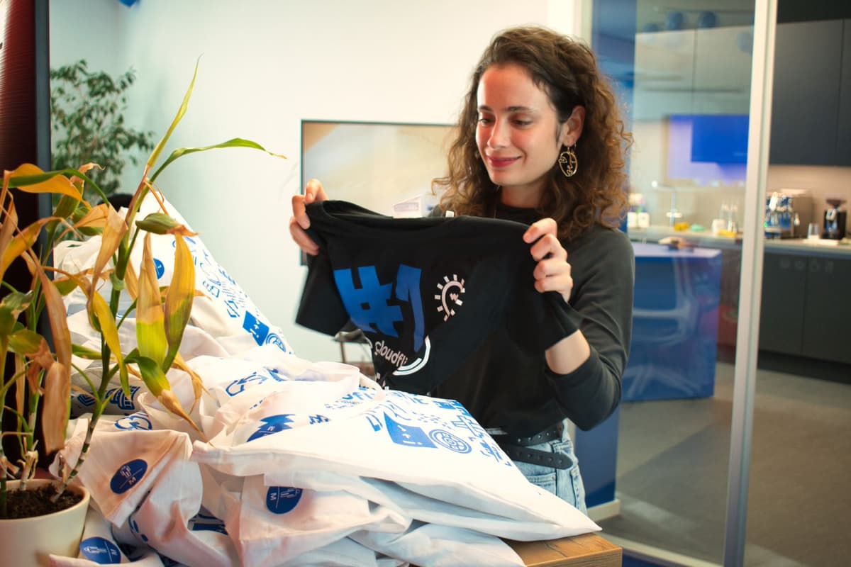Girl looking at shopping bags that are branded with cloudflight logo