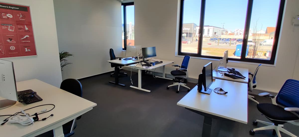 Office space with tables and LCD displays